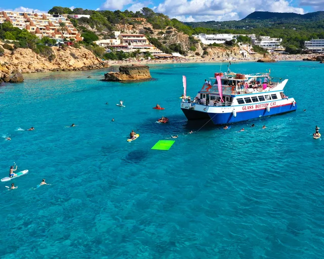 Boat anchored in a turquoise cove