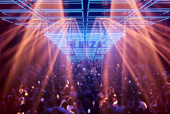 Hï Ibiza dance floor with lasers and a crowd